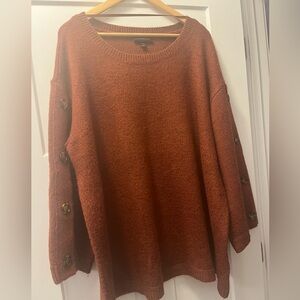 Rust colored oversized sweater w/ bell sleeves and button details on sleeves.EUC
